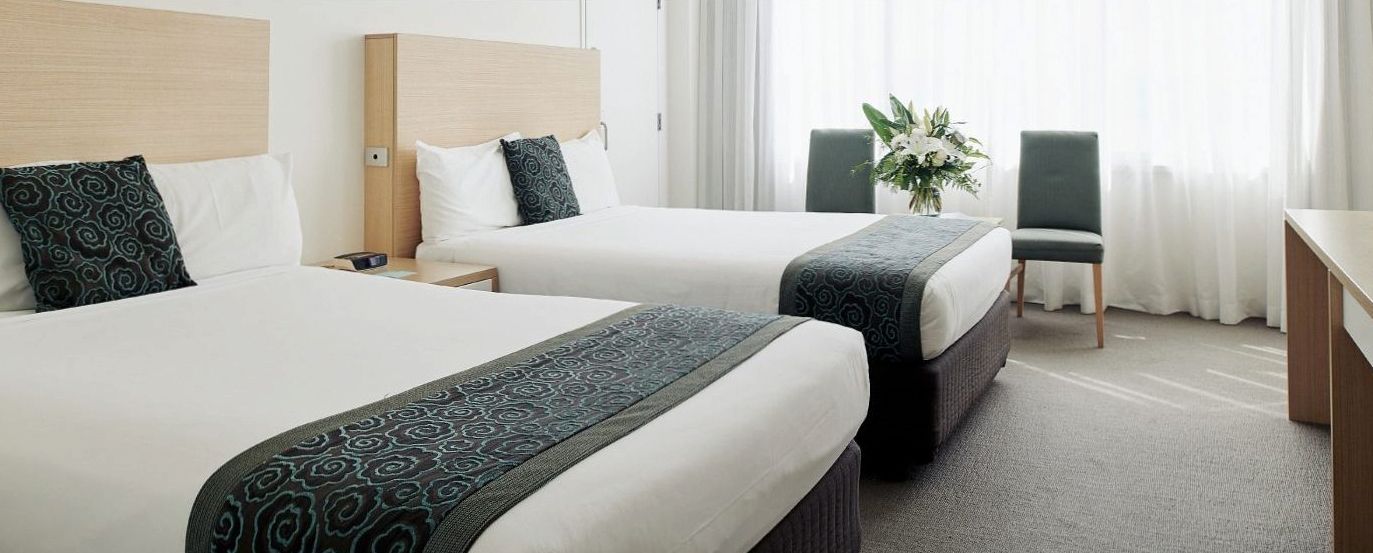 Deluxe Room with tropical-inspired colour palette at The Ville